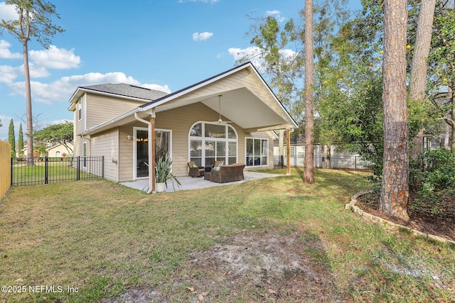 rear view of property with an outdoor living space, a yard, and a patio area