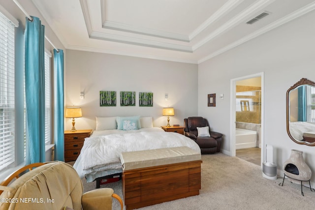 bedroom with visible vents, connected bathroom, ornamental molding, carpet flooring, and a raised ceiling