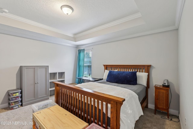 carpeted bedroom with crown molding, baseboards, a raised ceiling, and a textured ceiling