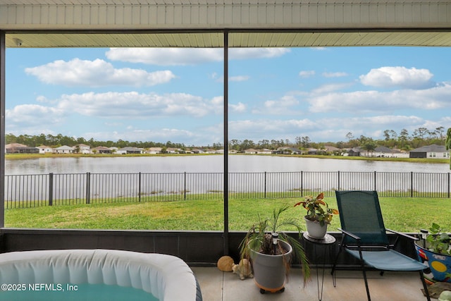 sunroom with a water view