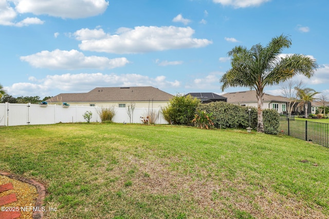 view of yard featuring a fenced backyard