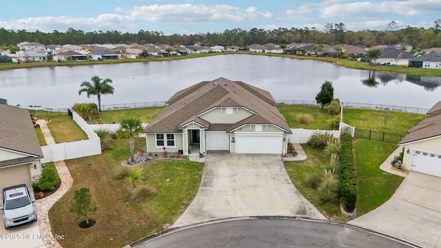 bird's eye view featuring a residential view and a water view