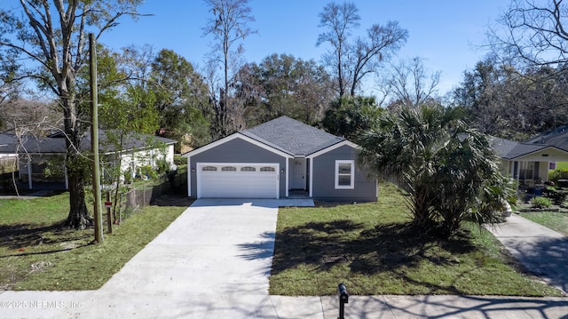 view of front of property featuring a garage and a front lawn