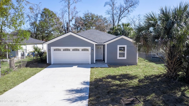 single story home with a garage and a front lawn