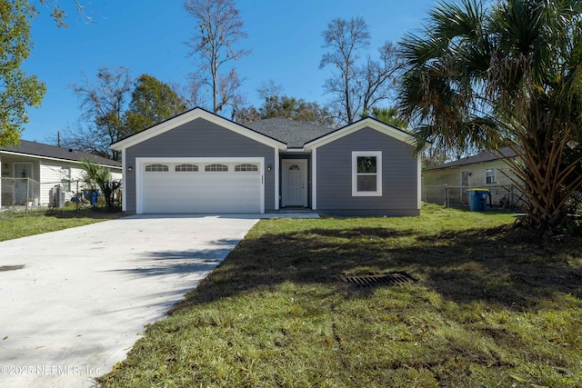 ranch-style home with a garage and a front lawn