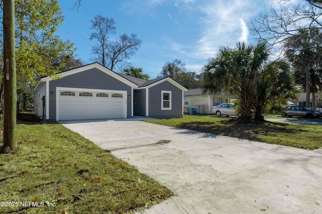 ranch-style house featuring a garage and a front yard