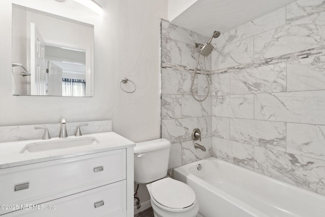 full bathroom featuring vanity, toilet, and tiled shower / bath combo