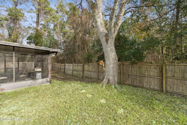 view of yard with a sunroom