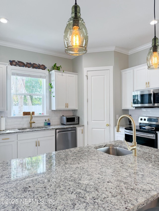 kitchen with sink, stainless steel appliances, and white cabinets