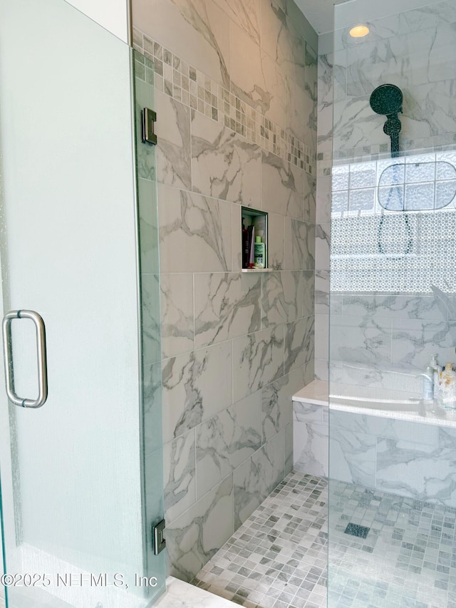 bathroom featuring an enclosed shower