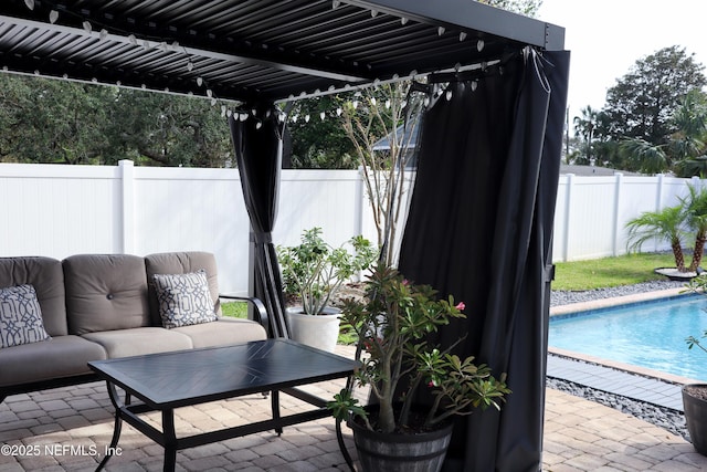 view of patio featuring a fenced in pool, an outdoor hangout area, and a pergola