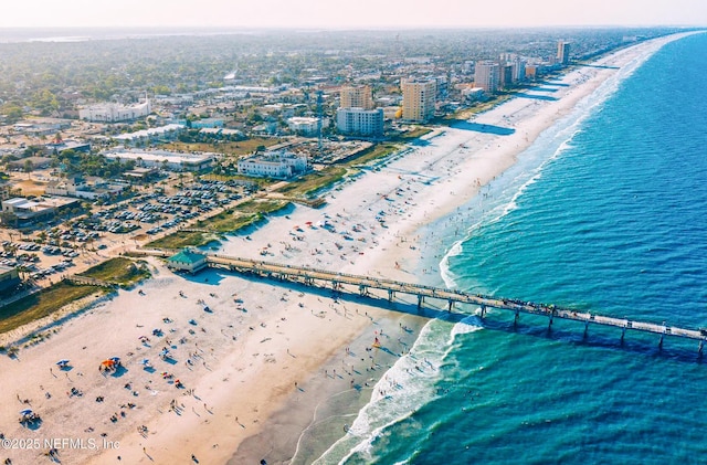 aerial view featuring a water view and a view of the beach