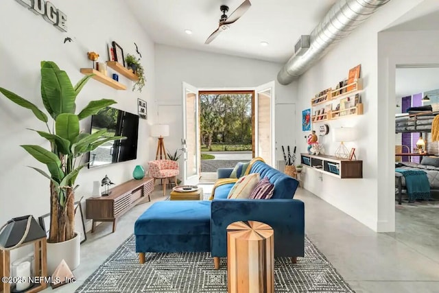 living area featuring concrete flooring and ceiling fan