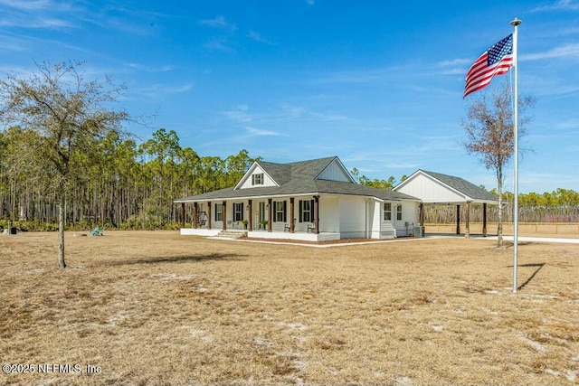 exterior space with a porch and a yard