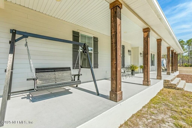 view of patio featuring a porch