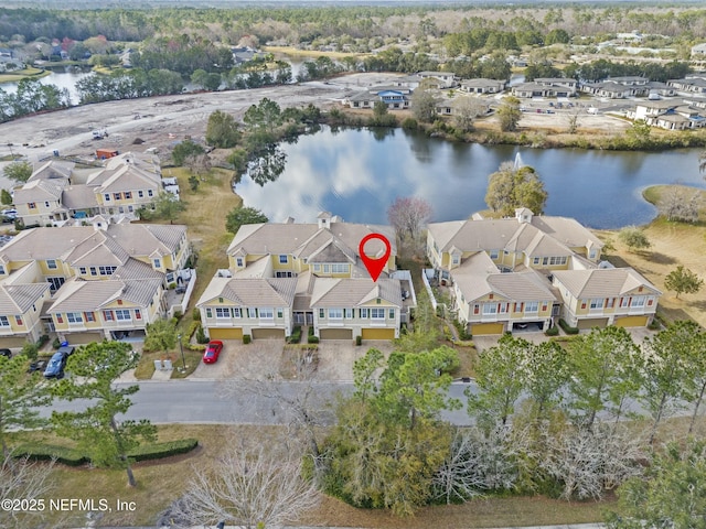 aerial view with a residential view and a water view