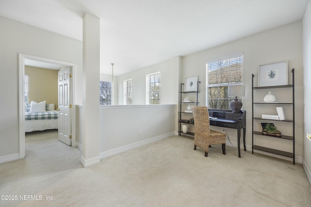 carpeted office featuring baseboards