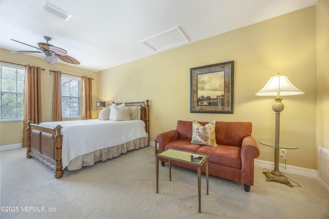 bedroom featuring baseboards, visible vents, light carpet, and attic access