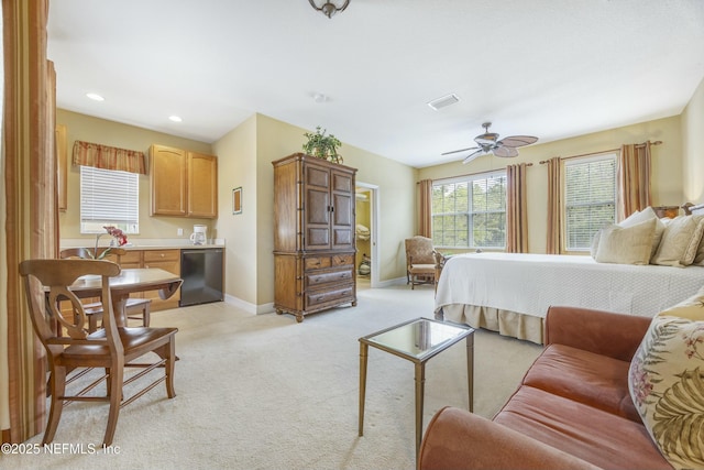 bedroom featuring recessed lighting, visible vents, baseboards, and light colored carpet