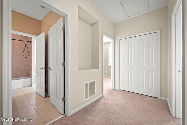 hallway with light tile patterned flooring