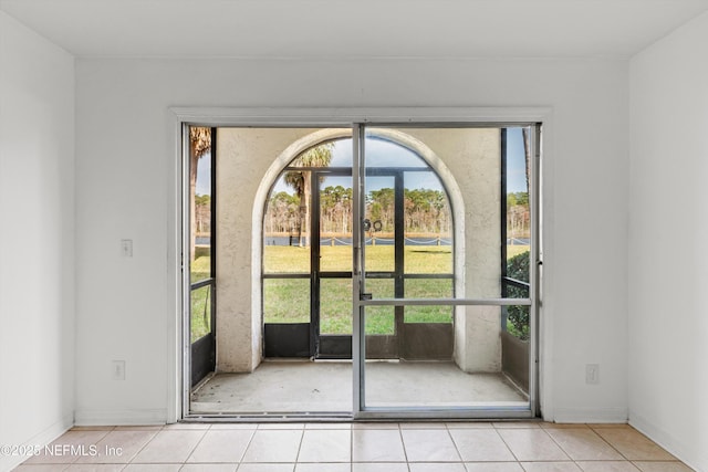 doorway featuring light tile patterned floors