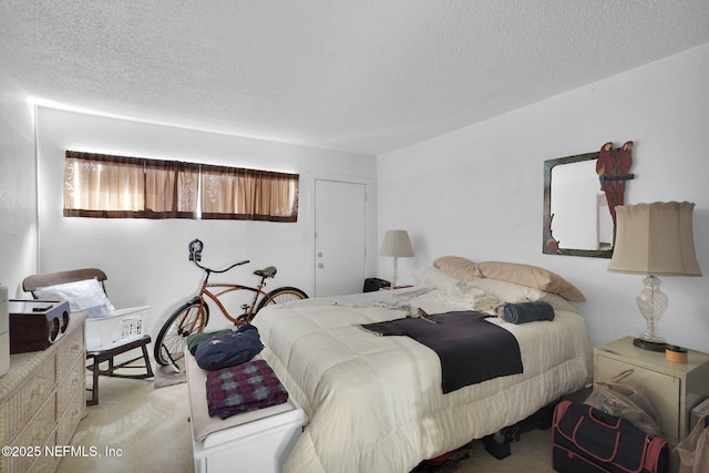 carpeted bedroom with a textured ceiling