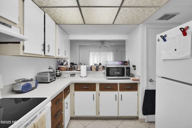 kitchen with white cabinetry, white appliances, ceiling fan, and light tile patterned flooring