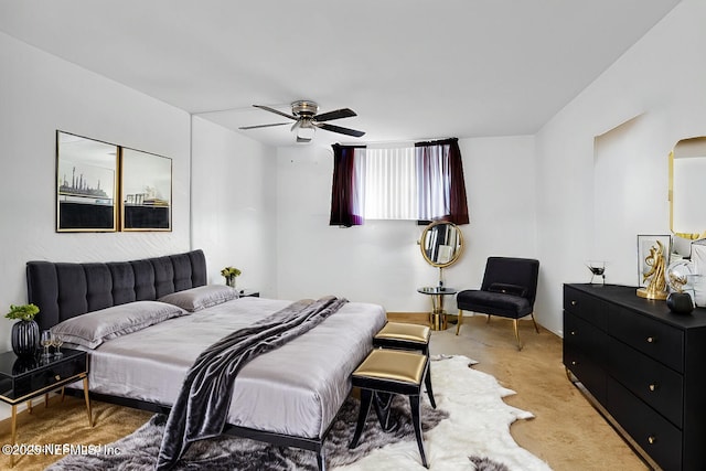 bedroom with light colored carpet and ceiling fan