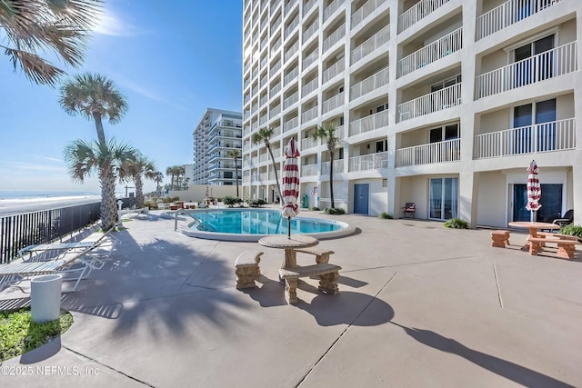 view of swimming pool with a patio area