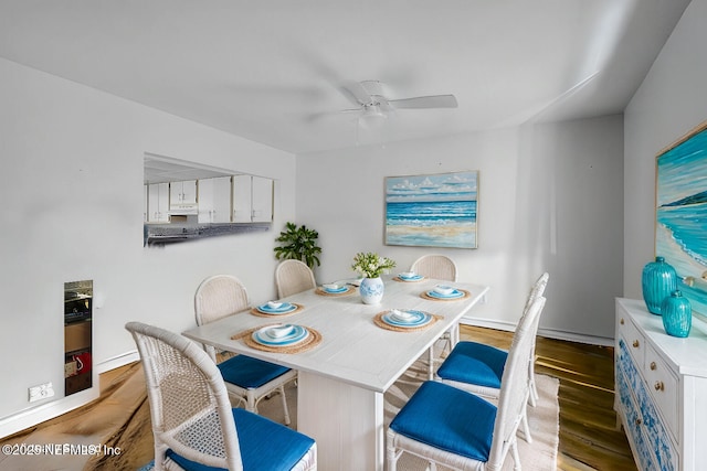 dining area featuring ceiling fan and light hardwood / wood-style flooring