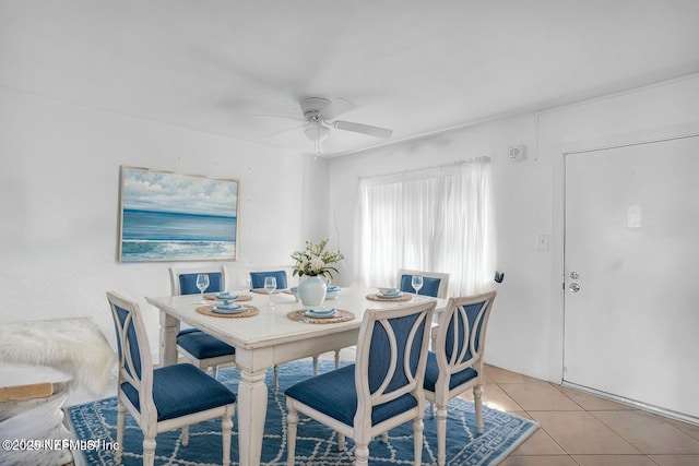 dining room featuring light tile patterned floors and ceiling fan