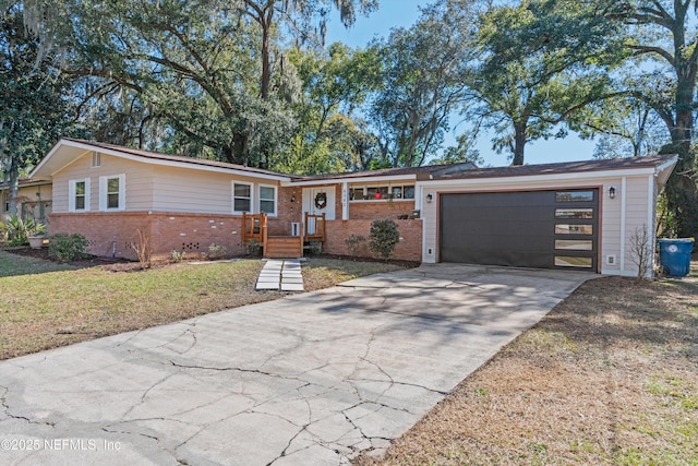 ranch-style house with a garage and a front yard