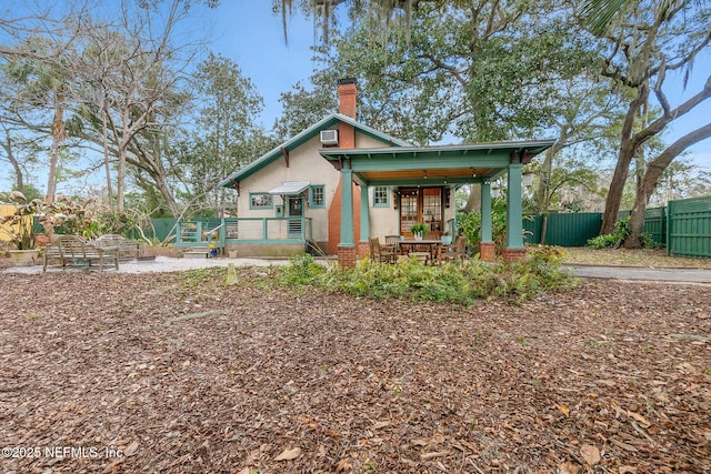 back of house with a porch