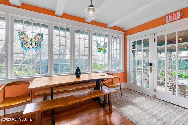 sunroom with french doors and beamed ceiling