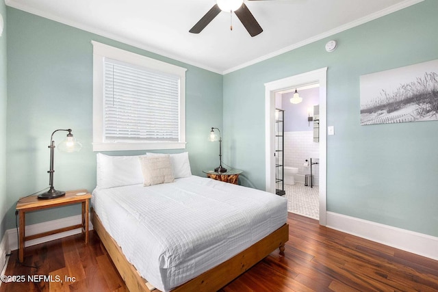 bedroom with crown molding, ceiling fan, ensuite bathroom, and dark hardwood / wood-style floors