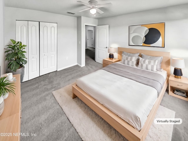 carpeted bedroom with ceiling fan and a closet