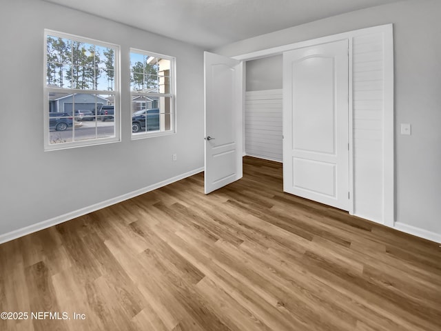 unfurnished bedroom featuring light wood-type flooring