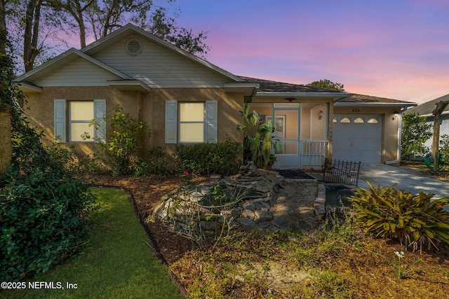 single story home with a garage