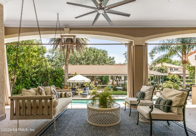 sunroom with ceiling fan