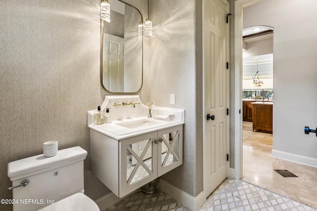 bathroom with vanity and toilet