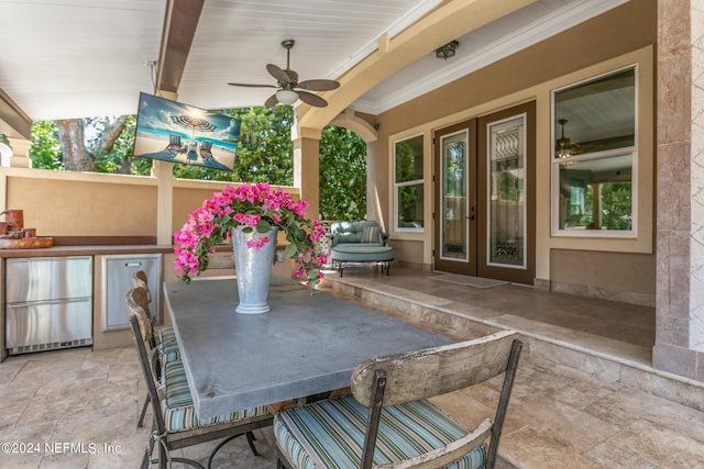 view of patio with area for grilling and ceiling fan