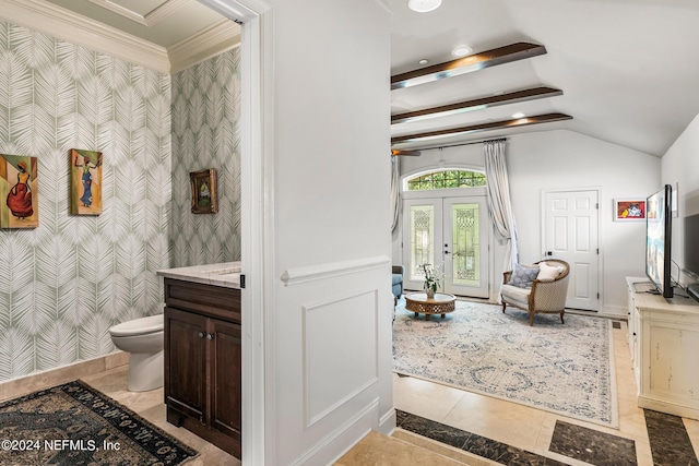 bathroom with vanity, vaulted ceiling, tile patterned floors, french doors, and toilet