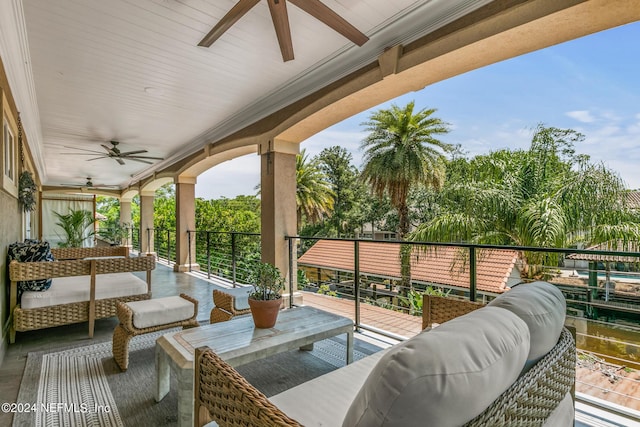 view of patio / terrace with ceiling fan and an outdoor living space