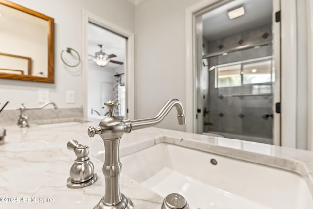 bathroom featuring vanity and ceiling fan