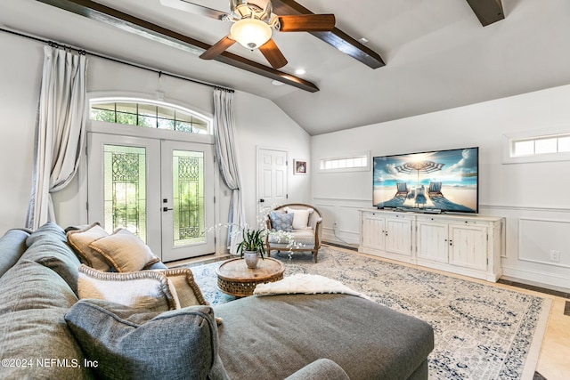 living room with lofted ceiling, light hardwood / wood-style flooring, french doors, and ceiling fan