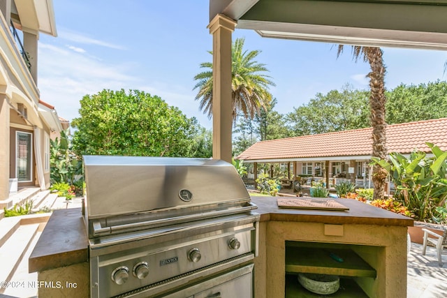 view of patio / terrace with an outdoor kitchen and grilling area