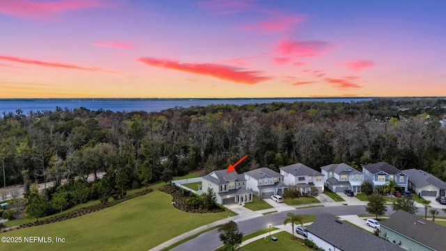 562 Kendall Crossing Dr, Saint Augustine, FL 32259 - aerial view at dusk with a residential view, a water view, and a forest view