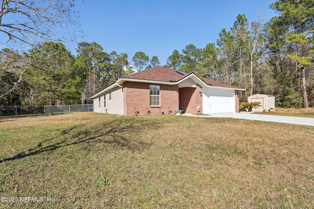 single story home featuring a garage and a front lawn