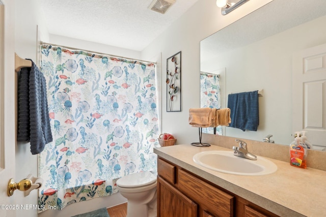 full bathroom featuring vanity, shower / bathtub combination with curtain, a textured ceiling, and toilet