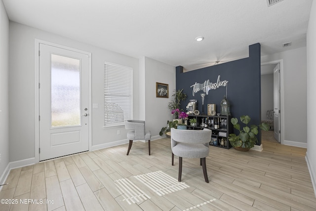 sitting room with light hardwood / wood-style floors